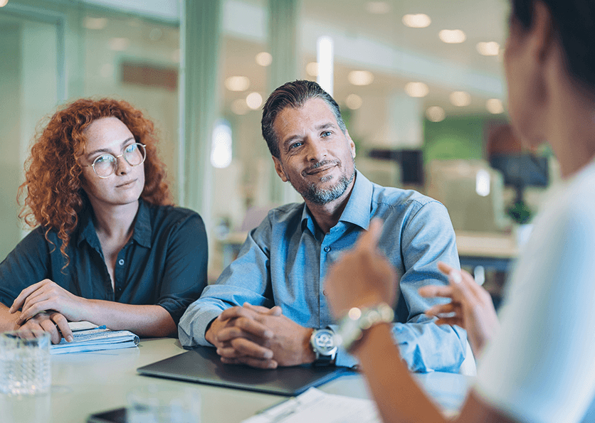 Couple meeting with a financial advisor to discuss their financial goals and planning