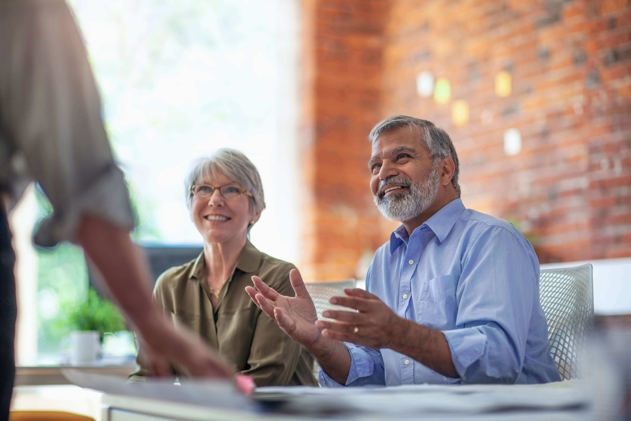 Couple approaching retirement meeting with a financial advisor to discuss retirement planning